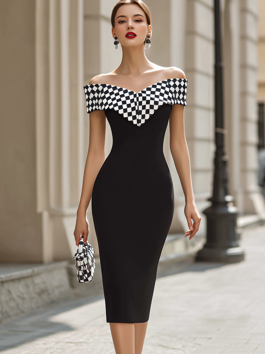Elegant black and white midi dress with shoulder cut-out