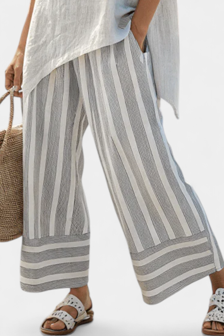 Daisy Szett Aszimmetrikus Pólóval és Csíkos Nadrággal a Modern és Elegáns Stílusért